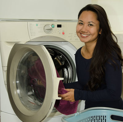 Photo of woman doing laundry.